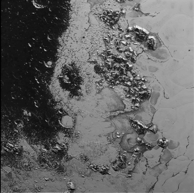Illustration for article titled Newly-Discovered Mountains on Pluto Finally Have Those Missing Craters